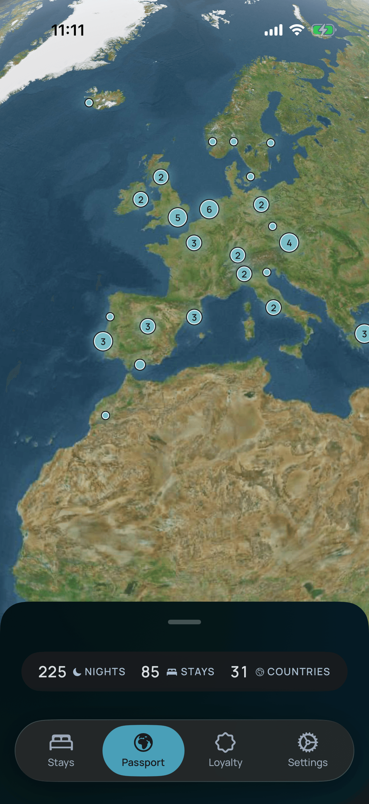 The Passport screen: a satellite globe over Europe and North Africa, pinned with everywhere you have stayed, totalling 225 nights, 85 stays and 31 countries.
