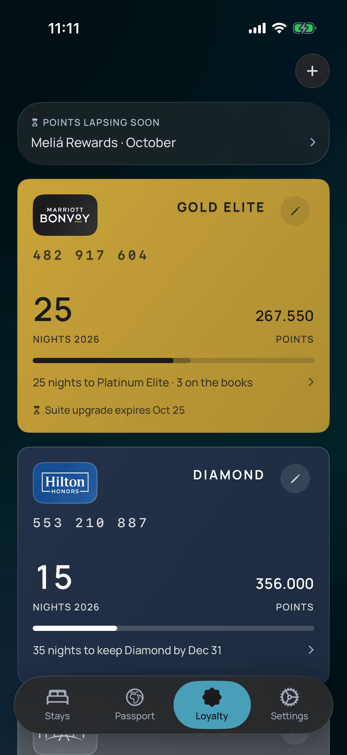 The Loyalty screen of the Stayed app: two programme keycards showing membership numbers, this year’s night counts, qualification bars and how many nights remain to keep each tier.